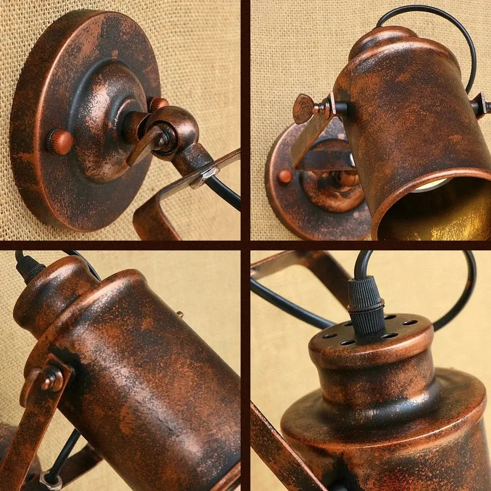 Close-up details of an antique-style rustic wall sconce, showcasing the aged metal finish and adjustable joints.