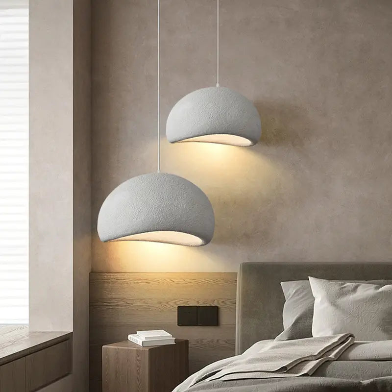 Cozy bedroom lighting with two white dome-shaped hanging lamps