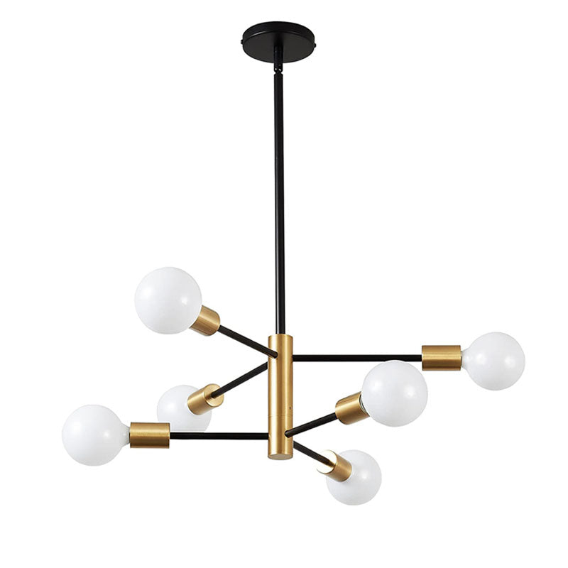 Minimalist black and gold sputnik chandelier lighting up a warm dining room with wooden furniture and decorative elements.