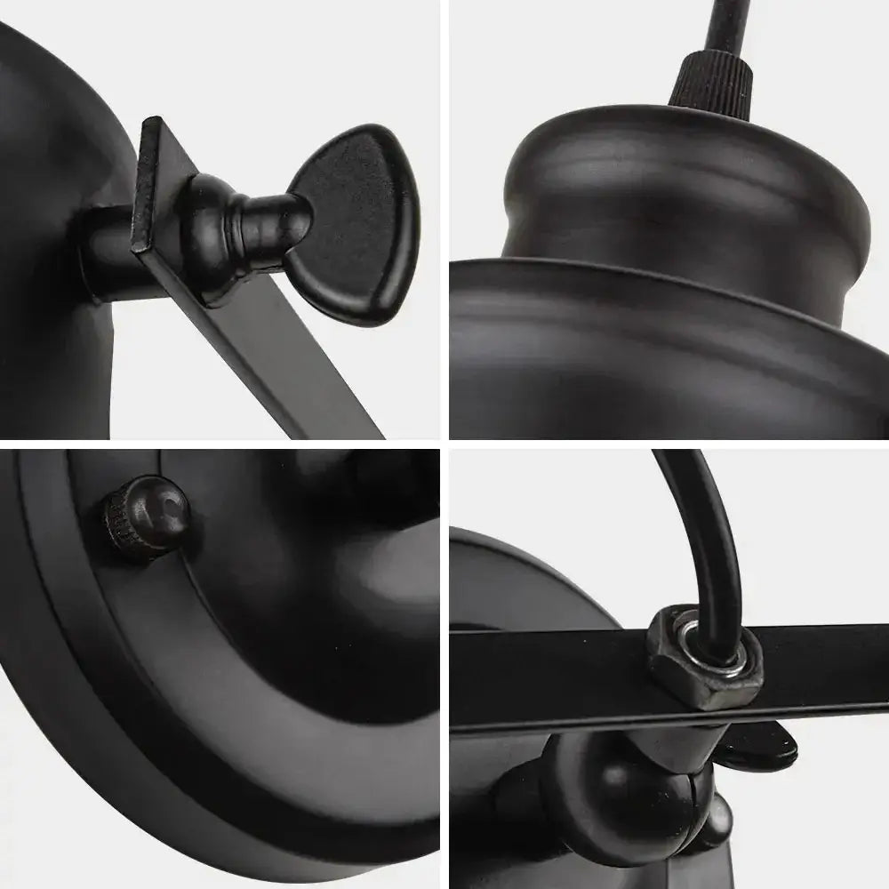 Detailed close-up of a black industrial wall light fixture, showing high-quality metal construction and adjustable components.