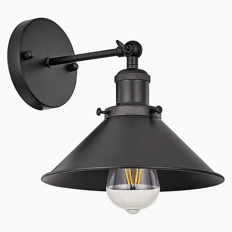 Close-up of a sleek black industrial wall sconce, highlighting its minimalist and modern design.