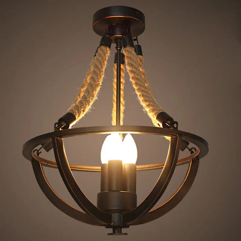 Black metal chandelier with natural rope suspension, a unique combination of vintage and industrial design.