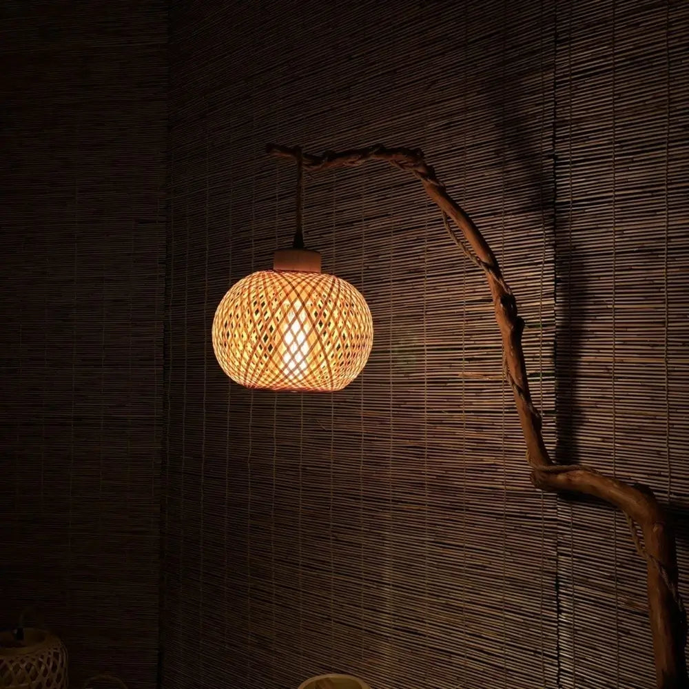 Boho rustic style handmade bamboo lamp glowing in ambient evening light