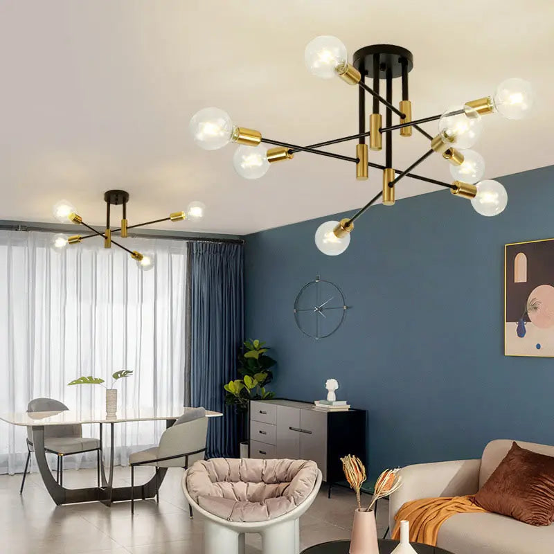 Contemporary black and gold chandelier-style ceiling light, suitable for dining and living rooms.