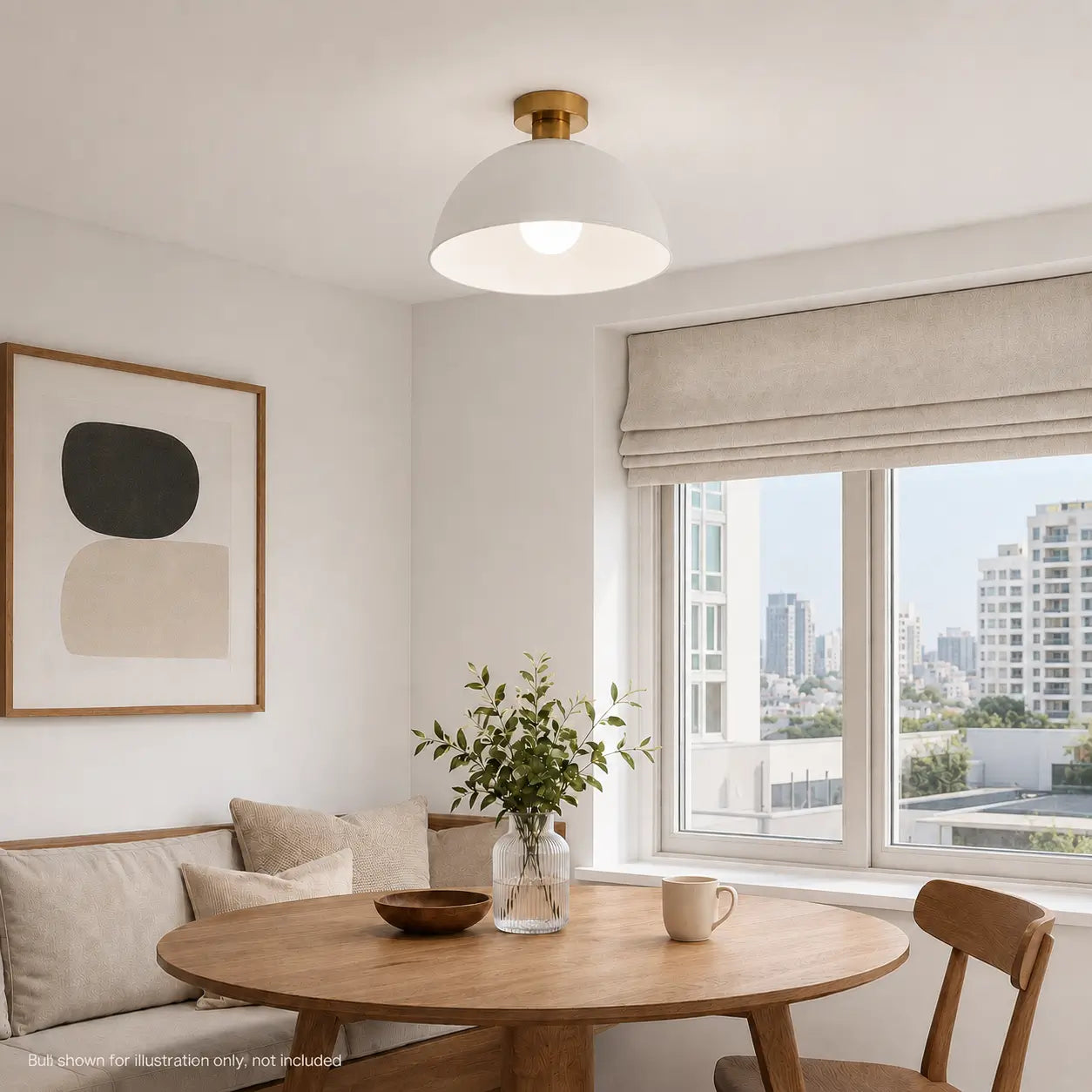 White dome ceiling light with a brass canopy installed above a round dining table with a city skyline view