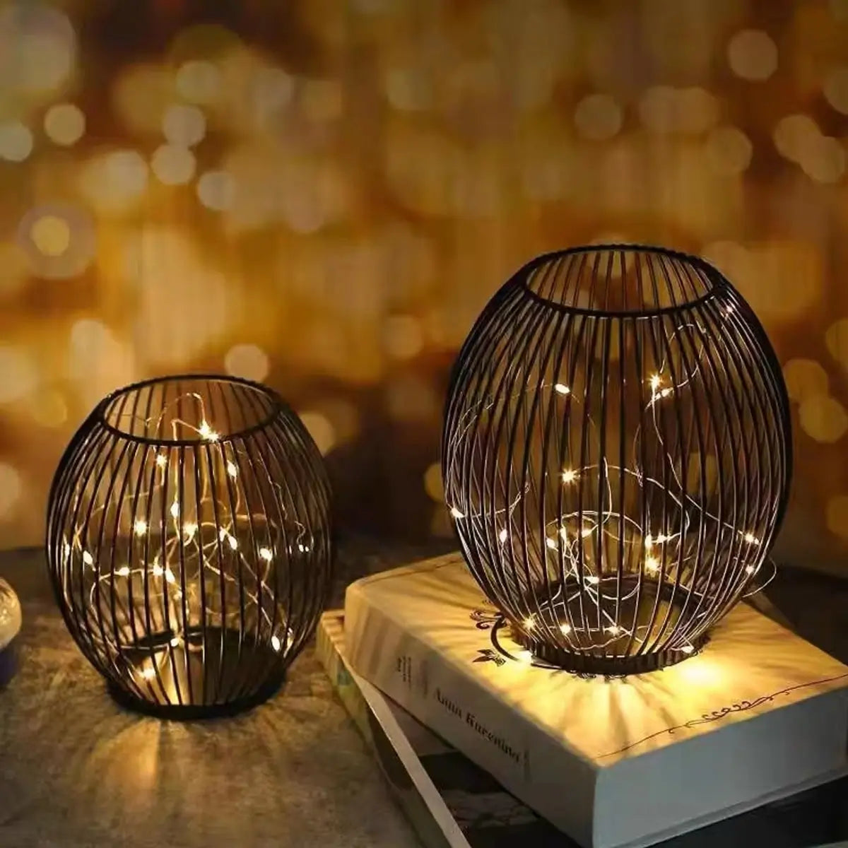 Black metal wire candle lanterns with fairy string lights, perfect for warm and cozy home decor, patio, or romantic settings.