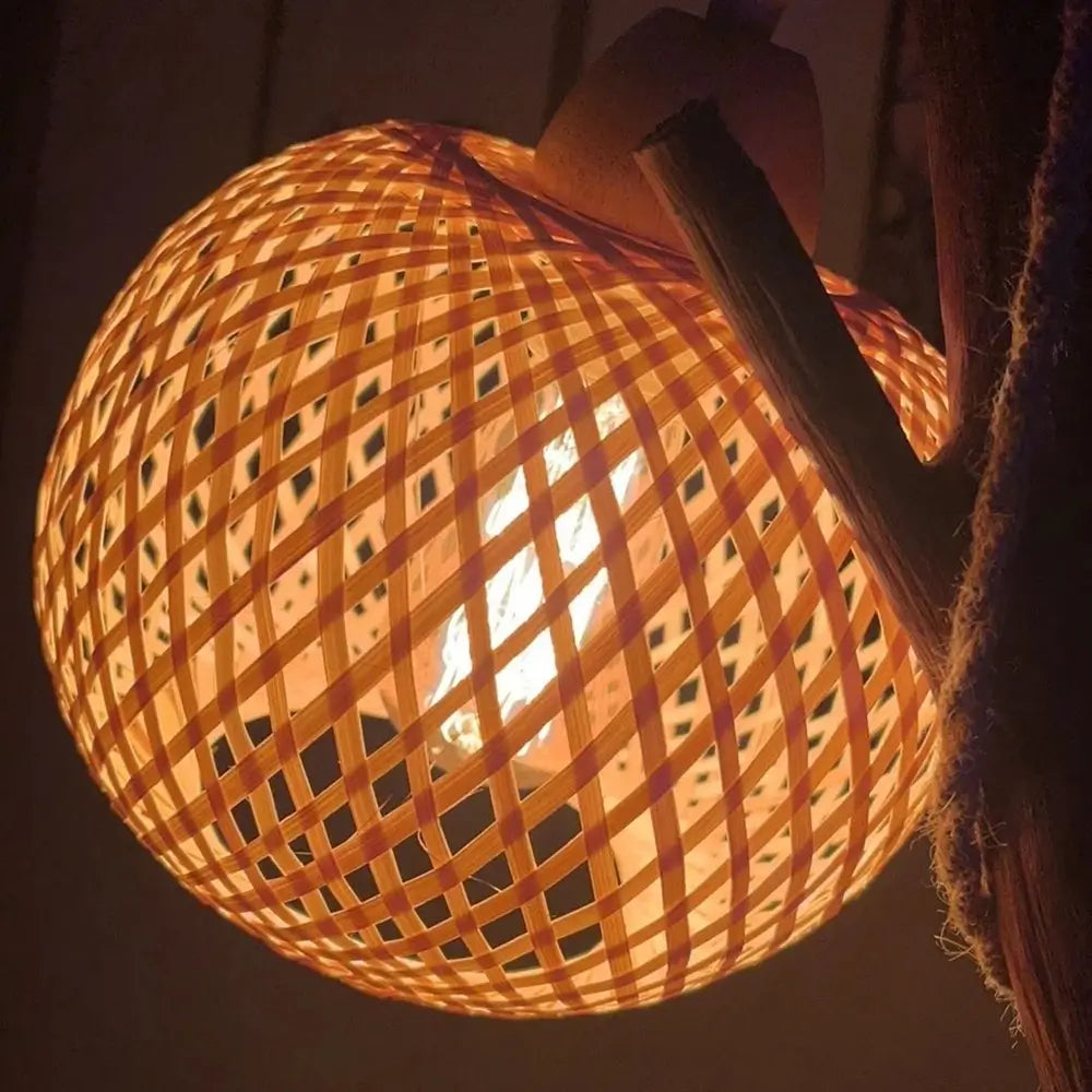 Handwoven bamboo lampshade glowing warmly for cozy room ambiance