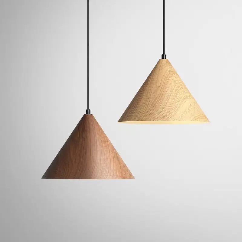 Pair of iron pendant lights with light and dark faux wood finishes.