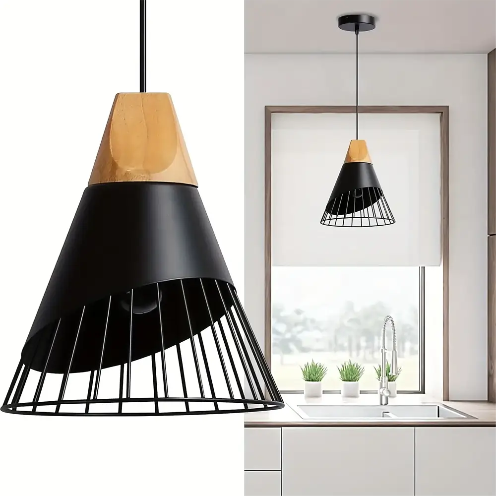 Black industrial-style pendant light with a wooden top installed above a kitchen sink.