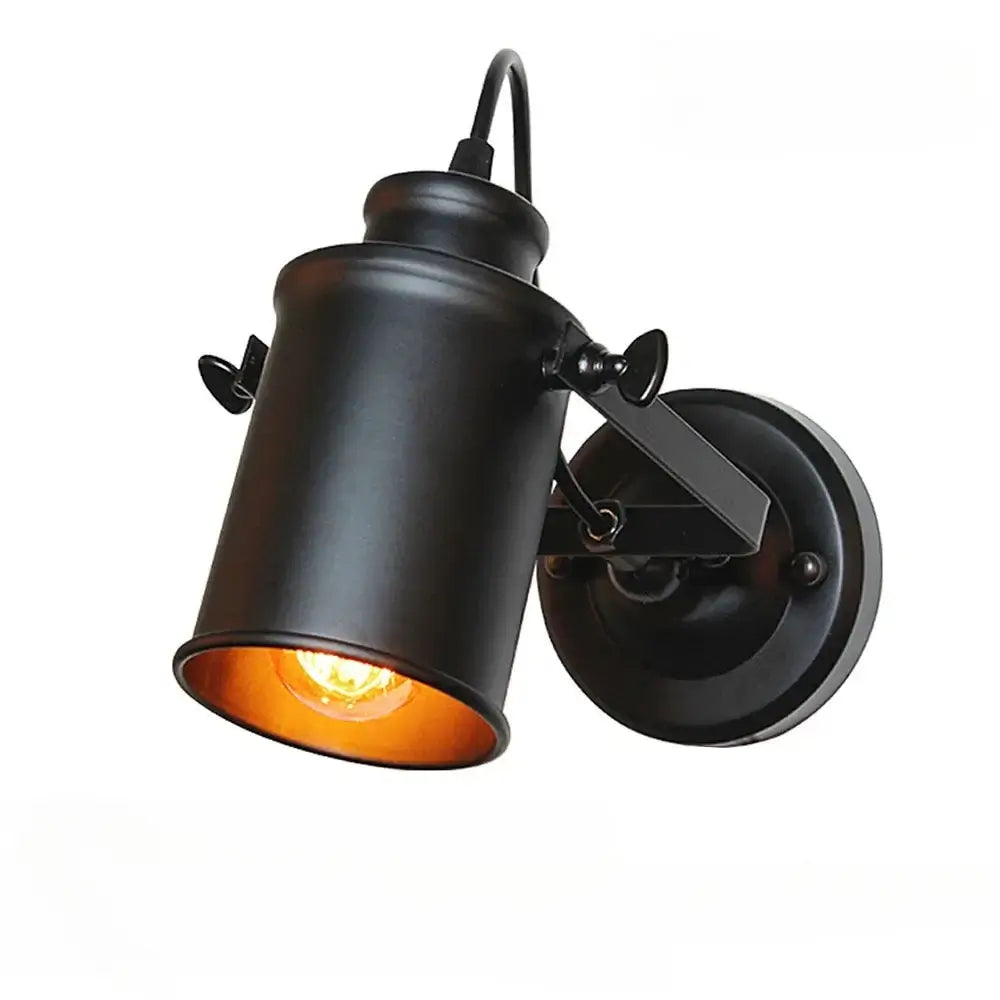 Matte black vintage wall sconce with an industrial-style design, featuring an LED Edison bulb for warm lighting.