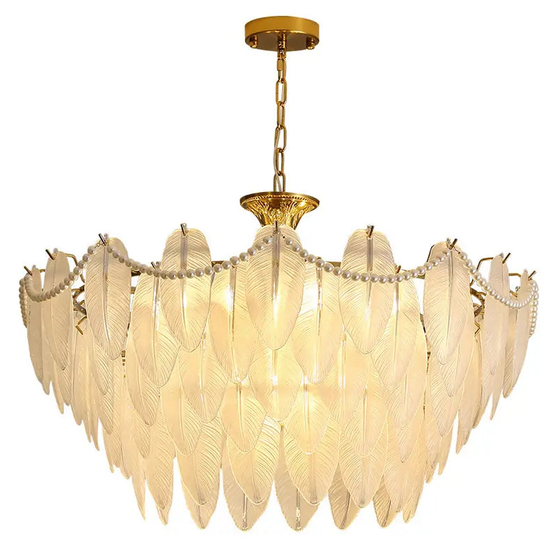 Elegant modern chandelier with gold accents and translucent feather-shaped glass pendants, ideal for luxurious interiors.