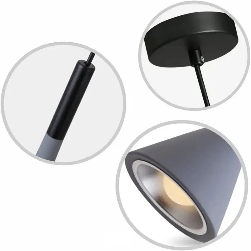 Detailed view of a modern pendant light, showing the black ceiling rose, adjustable suspension cable, and the grey cone-shaped lamp shade with an integrated light source.