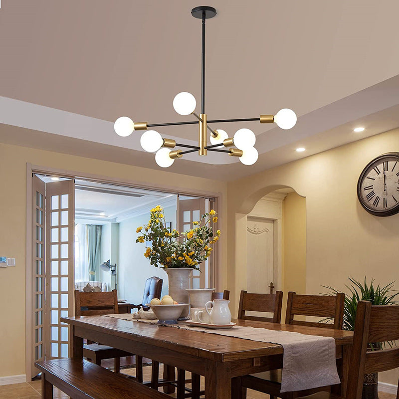 Full view of the modern sputnik chandelier with a minimalist black and gold design, featuring 6 lights against a plain background.