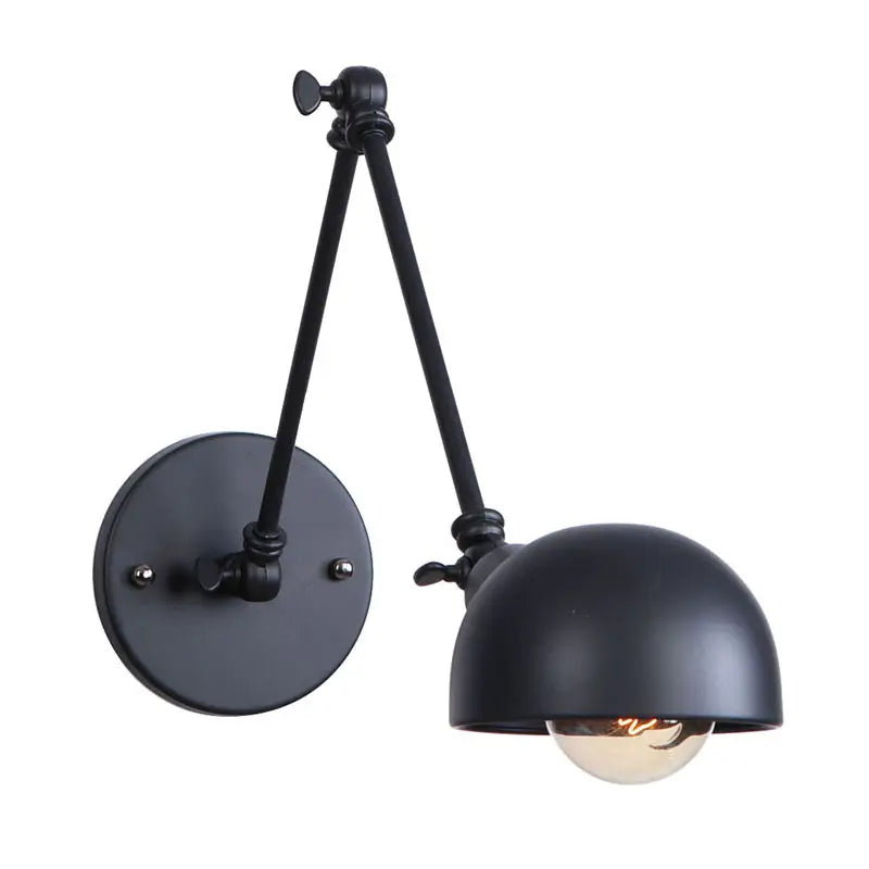 Close-up of a modern vintage black wall sconce with dual adjustable arms, designed for stylish and functional lighting.