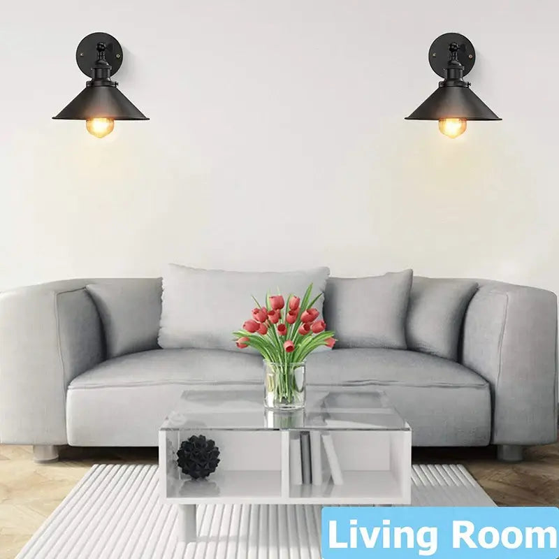 Modern wall sconce lighting in a living room, creating a cozy and decorative ambiance above a sofa.