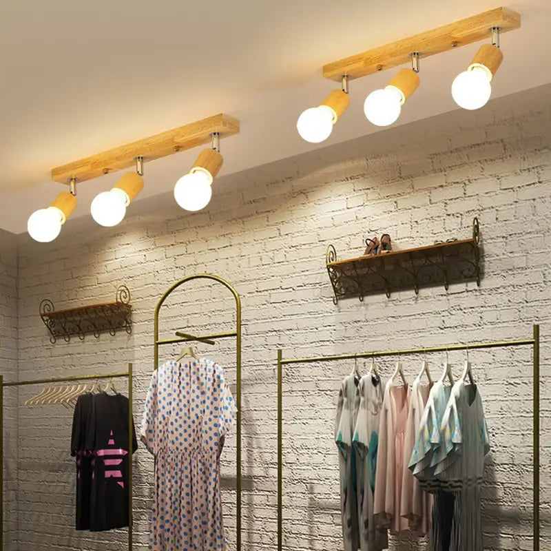 Wooden ceiling track lighting used in clothing retail store interior