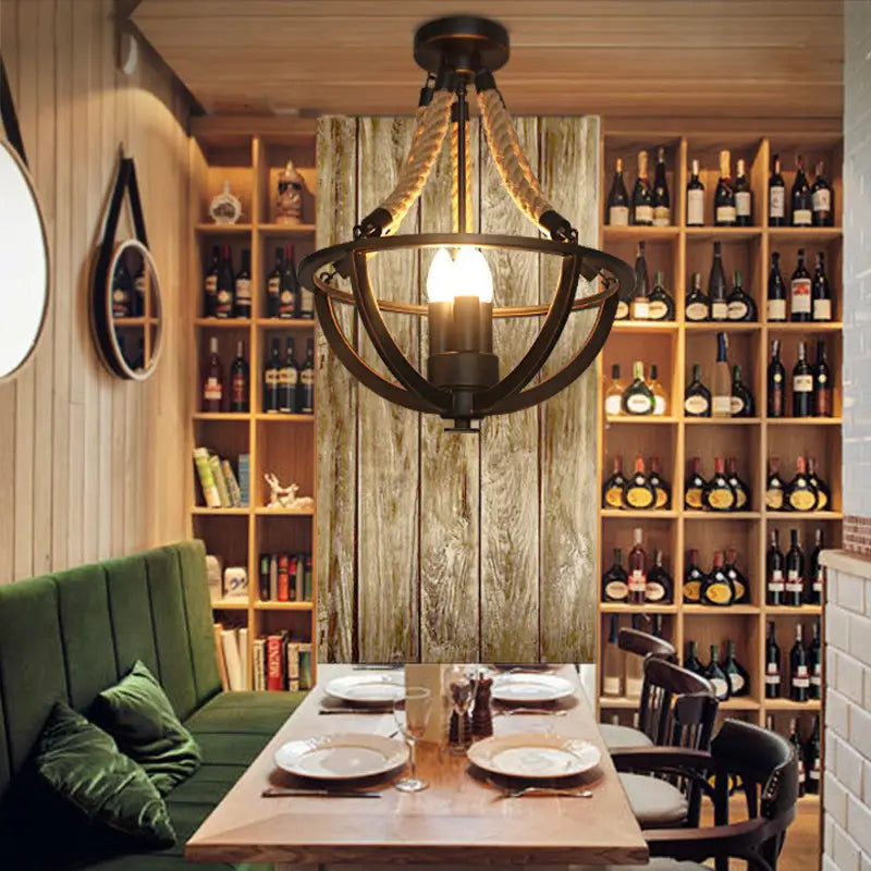 Retro rustic ceiling chandelier with a distressed metal finish and nautical-style rope, blending industrial and farmhouse aesthetics.