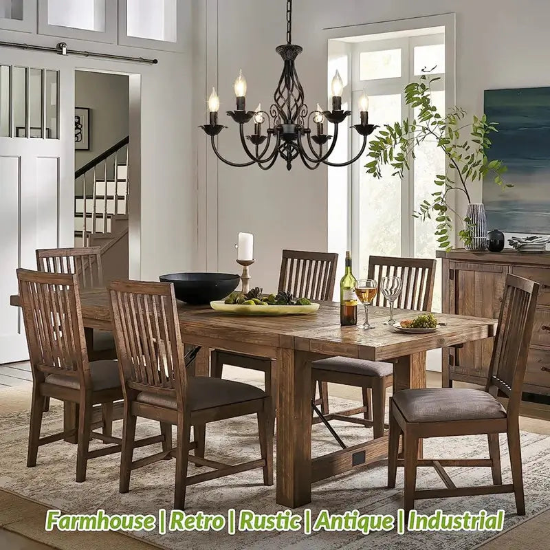 Rustic farmhouse chandelier illuminating a wooden dining room table with matching chairs, ideal for farmhouse or vintage decor.
