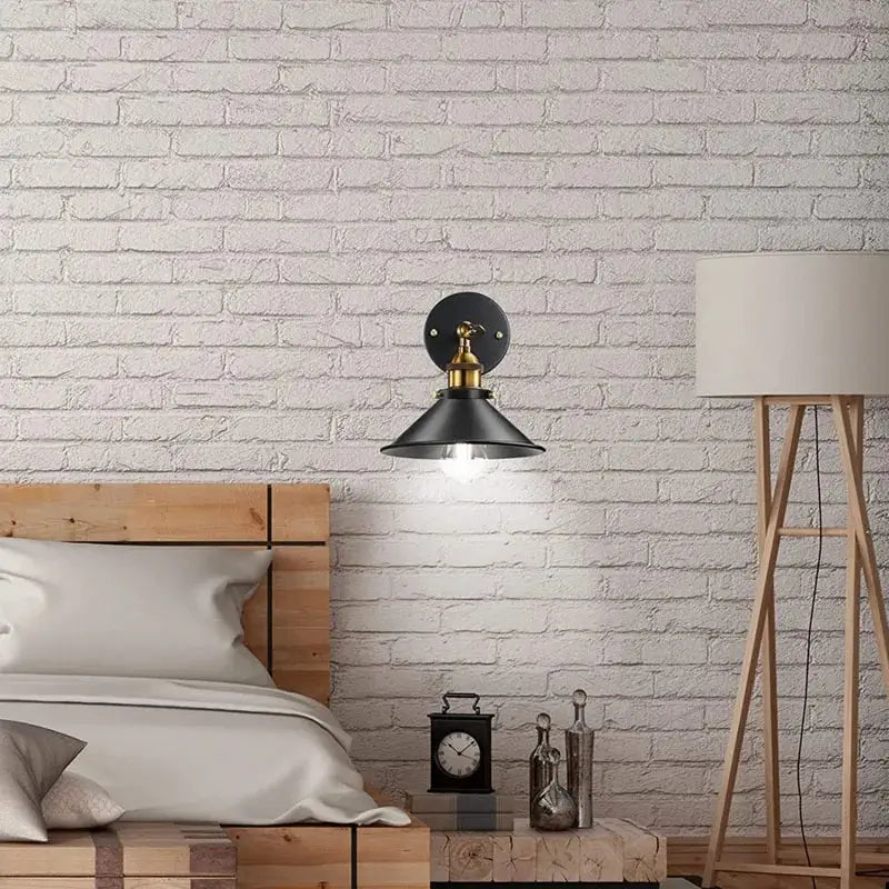 Wall sconce lighting for a cozy bedroom, providing a warm glow as a bedside reading lamp or night light.