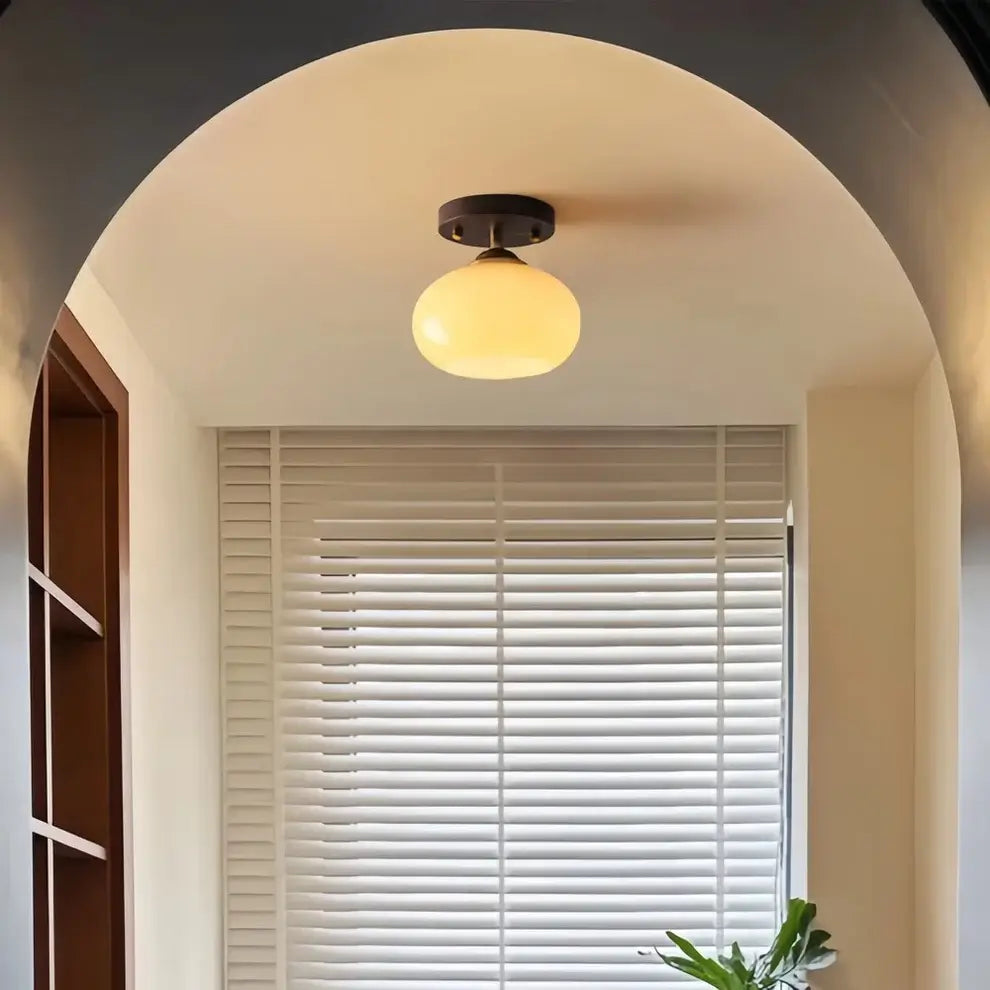Stylish walnut wood ceiling light featuring a unique ombre glass shade with a gradient effect, showcasing modern design.