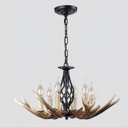 Front view of the antler chandelier with six candle-style lights, featuring a dark metal frame and realistic resin antlers.