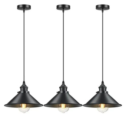 Three identical black industrial pendant lights with clear glass bulbs, hanging in a row against a white background.