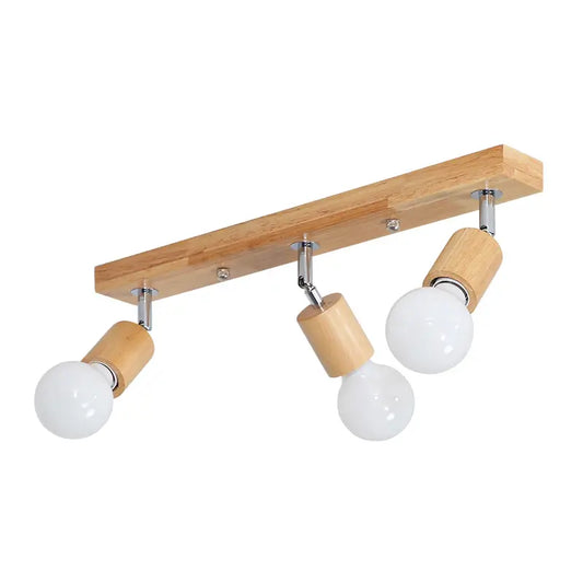 Adjustable wooden track spotlight with three bulb heads for ceiling mounting.
