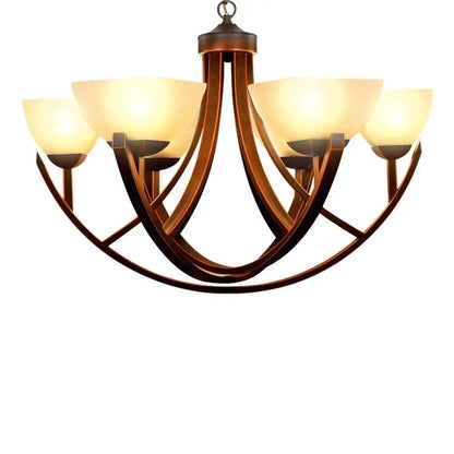 Antique bronze chandelier with curved arms and warm frosted glass shades.