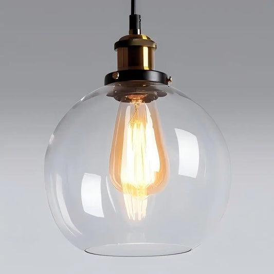 Clear glass globe pendant light with vintage style bulb.