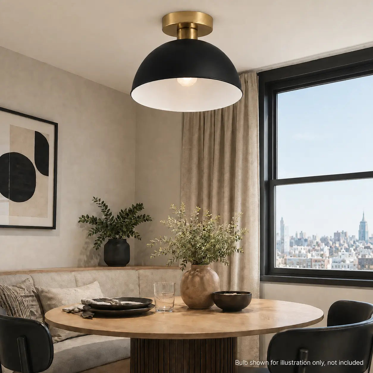Black dome ceiling light with a brass canopy installed above a round dining table with a city skyline view
