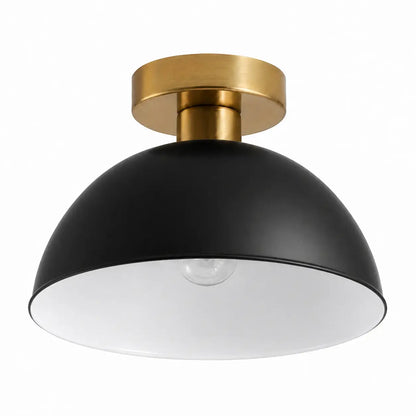 Black dome semi-flush mount ceiling light with a brushed gold canopy on a white background