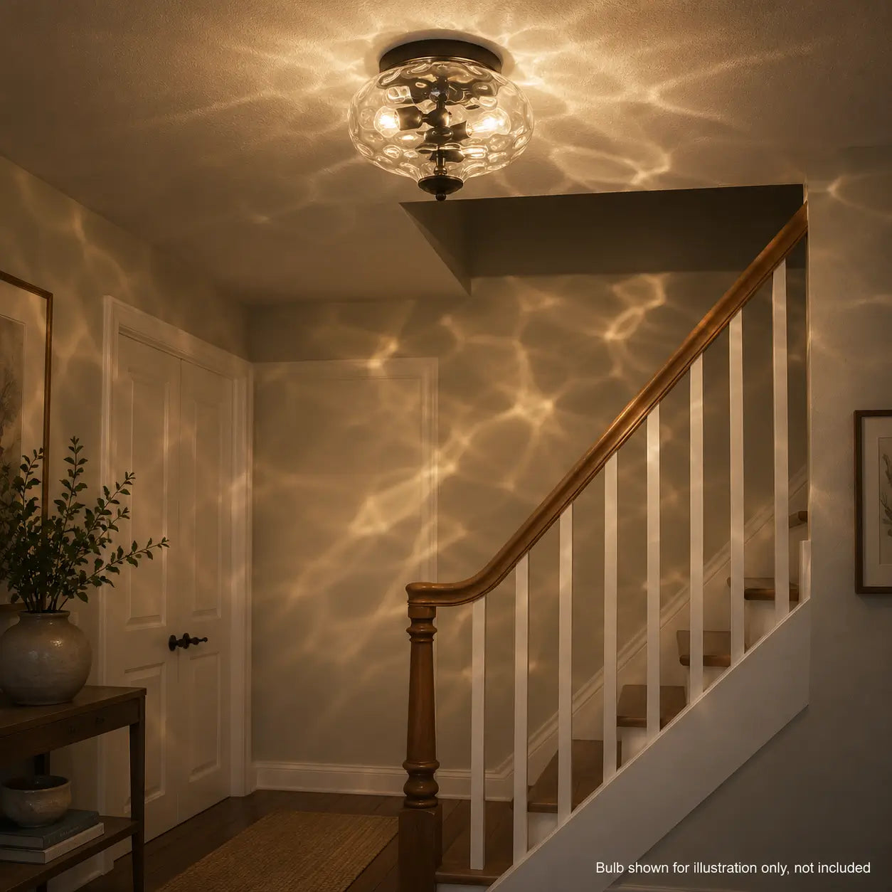 Flush mount ceiling light illuminated above a wooden staircase, casting a rippled light pattern across the walls.
