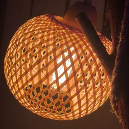 Handwoven bamboo lampshade glowing warmly for cozy room ambiance