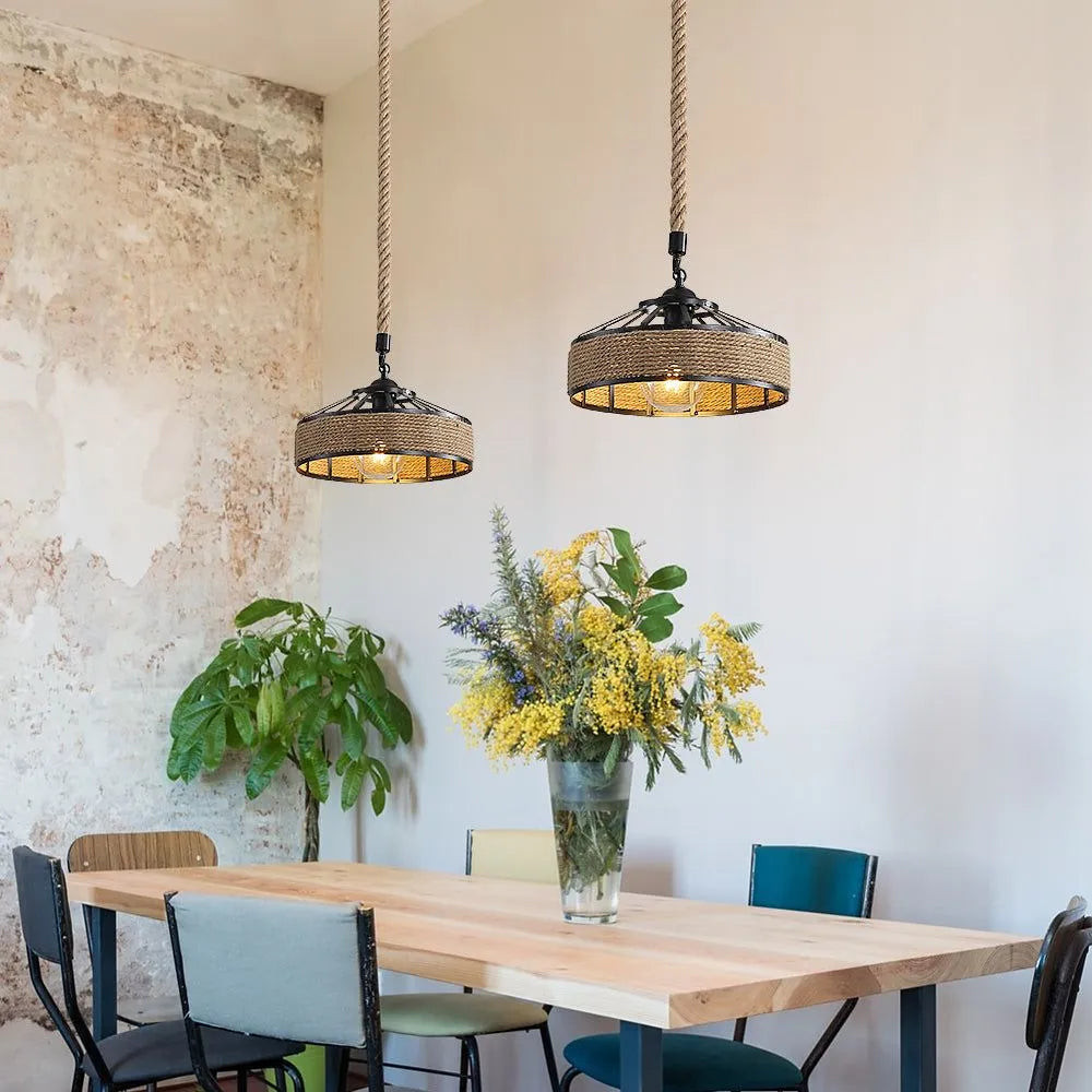 2 round hemp rope wrapped pendant lights with black frames light above the dining table