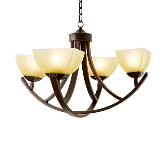 Modern bronze 4-light chandelier with frosted glass shades close-up view.