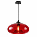 Red modern oval glass pendant light with black canopy and cord on a white background.