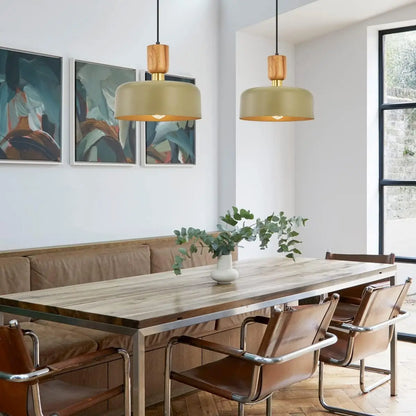 Set of two pendant lights above a wooden dining table in a contemporary setting