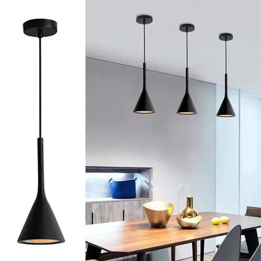 Close-up of a single black minimalist cone pendant light with a matte finish, showcasing its sleek design. Also showing three black pendant lights over a wooden dining table in a modern setting.