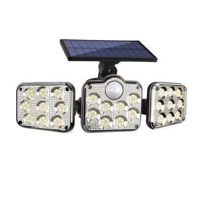Front view of the outdoor solar motion sensor security light with 3 adjustable heads, showcasing the 138 bright LED lights and central motion sensor for enhanced home security.