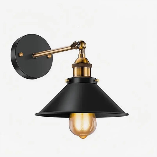 Vintage industrial wall sconce in black and gold, featuring an adjustable swing arm design perfect for modern farmhouse decor.