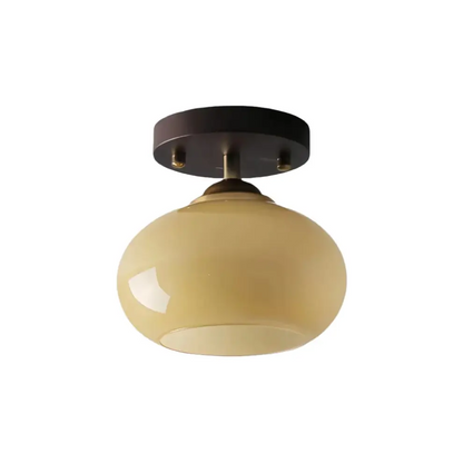 Walnut wood ceiling light featuring a warm cream-tinted opal glass shade, offering a subtle and inviting glow.