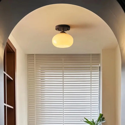 Stylish walnut wood ceiling light featuring a unique ombre glass shade with a gradient effect, showcasing modern design.